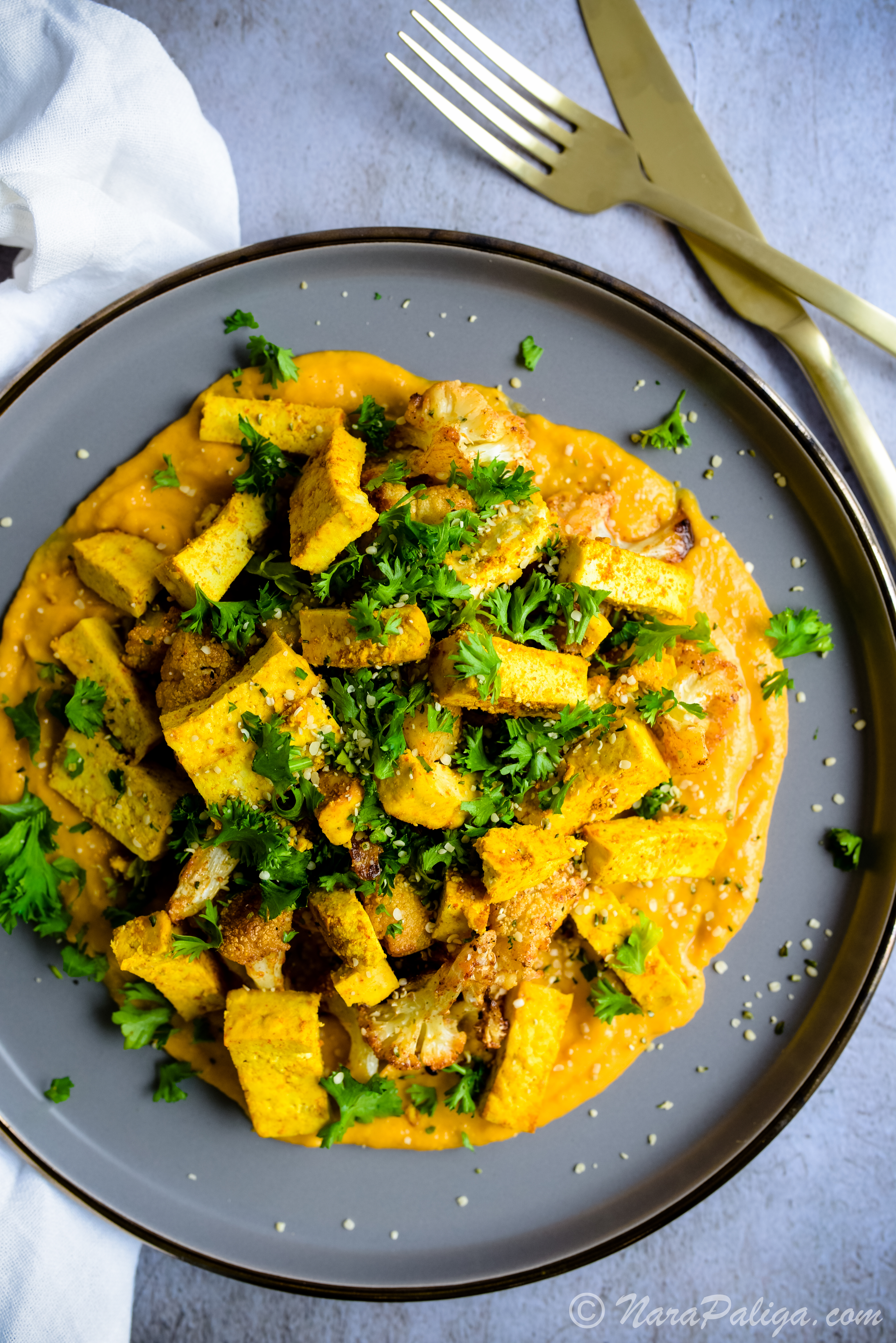 CRISPY CAULIFLOWER & TOFU, GENTLY NESTLED ON A BED OF BUTTERNUT SQUASH PUREE